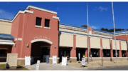 Building with stucco finish and arched doorway housing the Cobb elections headquarters