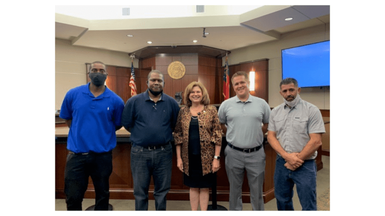 Judge Mary Staley Clark with graduates (from left) James, Jason, John and Joel.