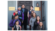 A group of Native Americans standing on the steps in front of the Embassy of Tribal Nations