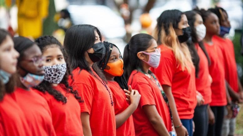 Row of children wearing masks