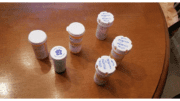 six prescription pill bottles