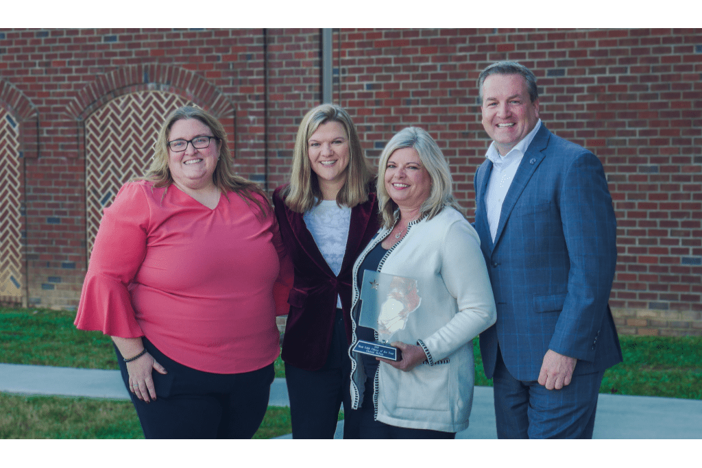 Standing in a row left to right Allison Giddens, 2021 Northwest Cobb Area Council Director; Sharon Mason, CEO of the Cobb Chamber; Christal McNair, 2021 West Cobb Citizen of the Year; John Loud, 2021 Cobb Chamber Chairman