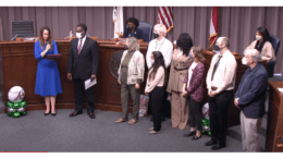 Screenshot of Commissioner Keli Gambrill presenting certificate to Cobb Public Services Director William Tanks and library Census Committee members