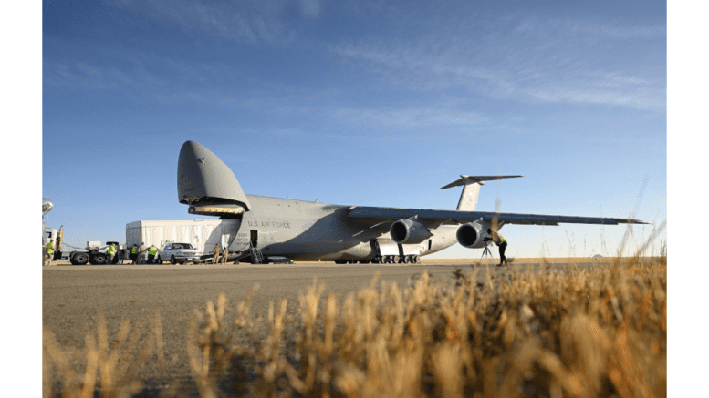 Satellite being loaded onto a C-5M aircraft