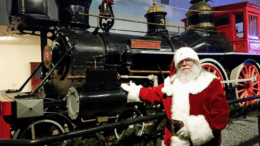 Santa beside a train