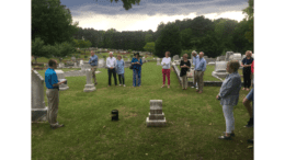 Andrew Bramlett speaks before an audience at Kennesaw City Cemetery