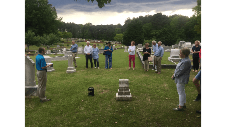 Andrew Bramlett speaks before an audience at Kennesaw City Cemetery