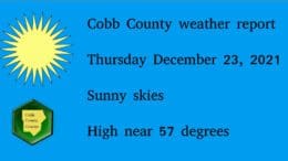 Sunny sky graphic with a sun above a Cobb County Courier logo followed by text: Cobb County weather report Thursday December 23, 2021 Sunny skies High near 57 degrees