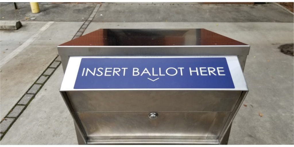 The mouth of a ballot box with the text "Insert Ballot Here"