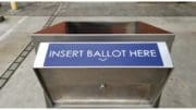 The mouth of a ballot box with the text "Insert Ballot Here"