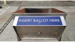 The mouth of a ballot box with the text "Insert Ballot Here"