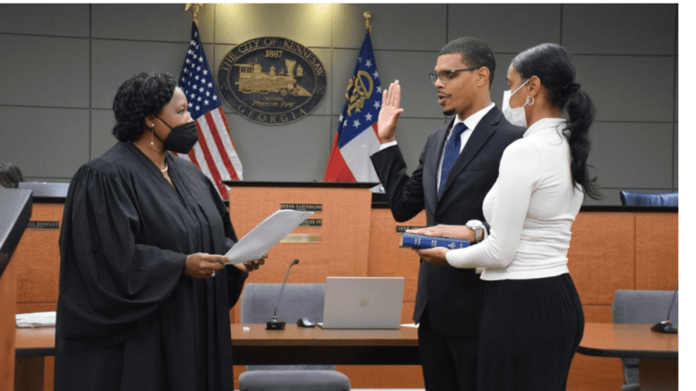 Antonio Jones, accompanied by fiancée Chantel Benjamin, was sworn in by the Honorable Kellie S. Hill.