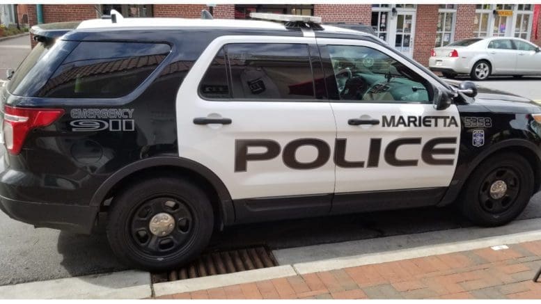 Marietta police SUV parked at the curb on Marietta Square