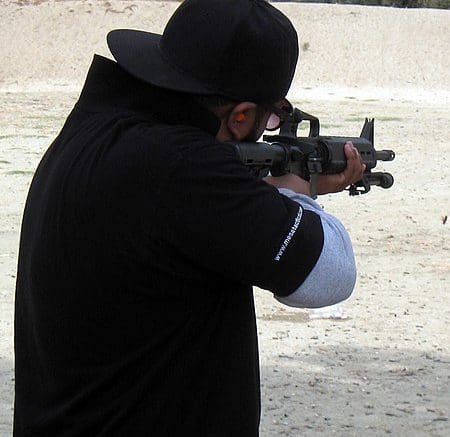 man firing AR 15