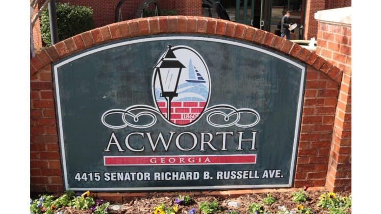 The sign in front of Acworth City Hall: Text reading Acworth Georgia 4415 Senator Richard B. Russell Ave, with 1860 (the incorporation date of the city)