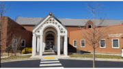 Front of Switzer Library, a brick building with a white columned entranceway