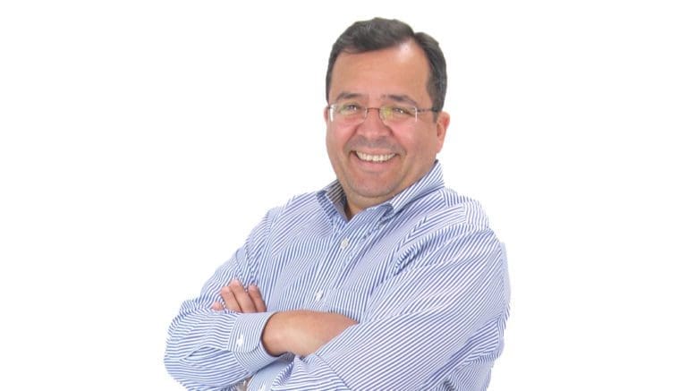 Vincent Mazzei upper body photo with arms crossed, smiling