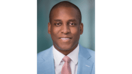 Titus Nichols in suit and tie, headshot