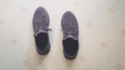 a pair of sneakers on a vinyl floor