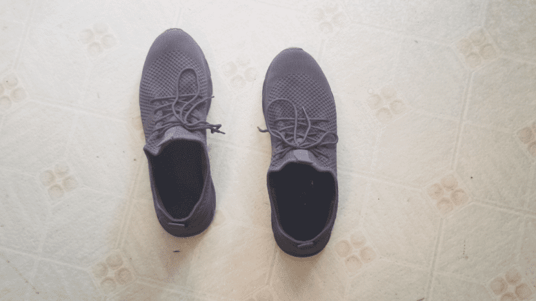 a pair of sneakers on a vinyl floor