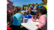 Photo of children around a table