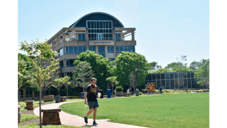 a student at KSU walks by a campus building