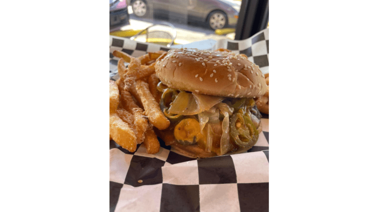 a huge hamburger with french fries