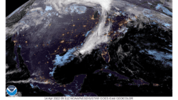 Satellite weather map of the eastern United States showing a band of clouds running north to south including Georgia