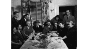 Refugees in Toronto gather around a table for seder in about 1945