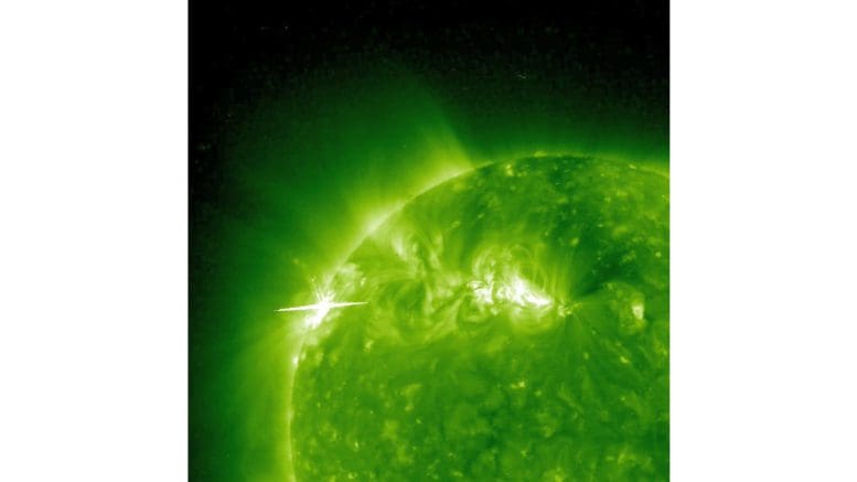 An image of the sun showing a solar flare on the left and an arc on the right