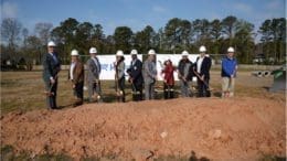 a group of people getting ready for a groundbreaking ceremony