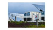 Solar panels surrounding a large battery array