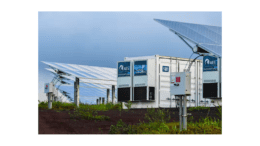 Solar panels surrounding a large battery array