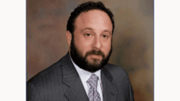 Headshot of Scott Halperin in coat and tie