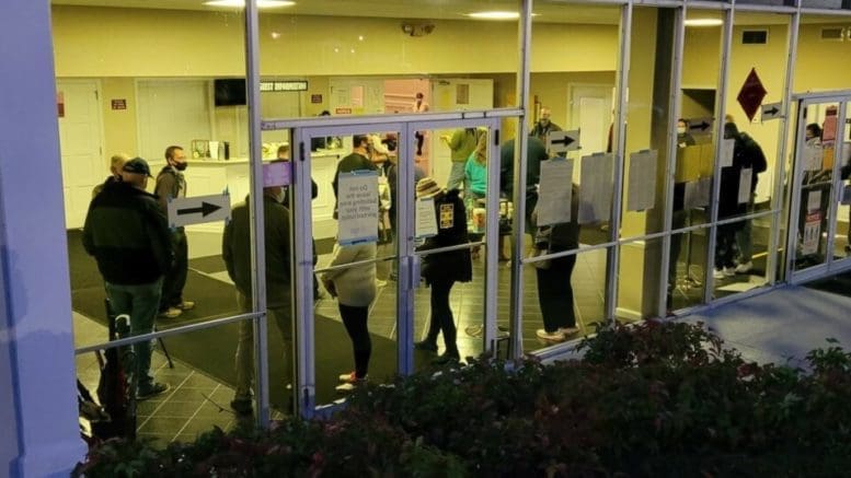 Voters who arrived early at Shiloh Hills Baptist Church in Kennesaw waited inside to stay warm until voting started in November 2020. Ross Williams/Georgia Recorder