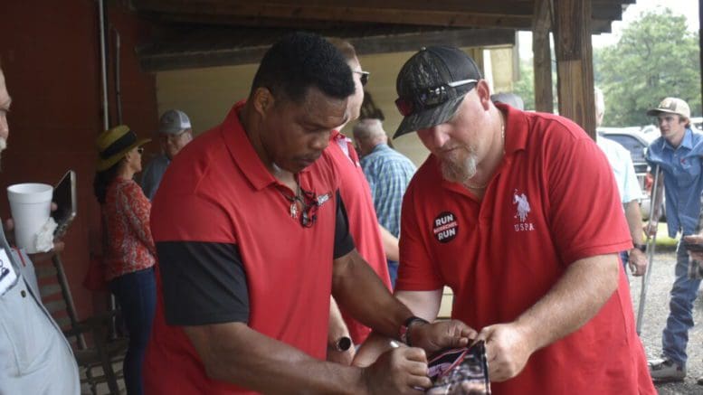 Herschel Walker signed autographs in July 2022 for fans at a livestock auction house in Athens. Ross Williams/Georgia Recorder