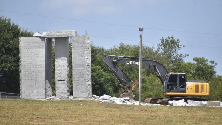 Photo of the remaining guidestones being demolished