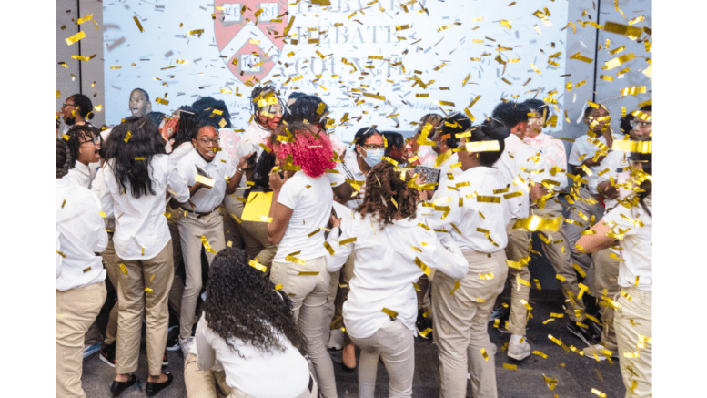 Students celebrating amid confetti
