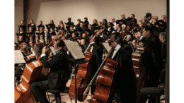 Photo of Georgia Symphony Orchestra performing, with cellists in foreground