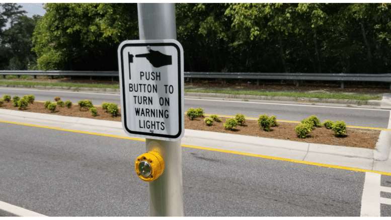 A crosswalk pedestrian button