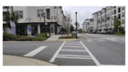 The retail corner of the Eddy at Riverview Landing.with crosswalks and outdoor tables