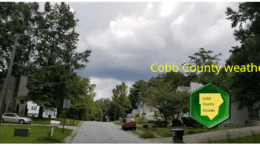 Cobb weather March 10: Photo of cloudy skies above a residential street