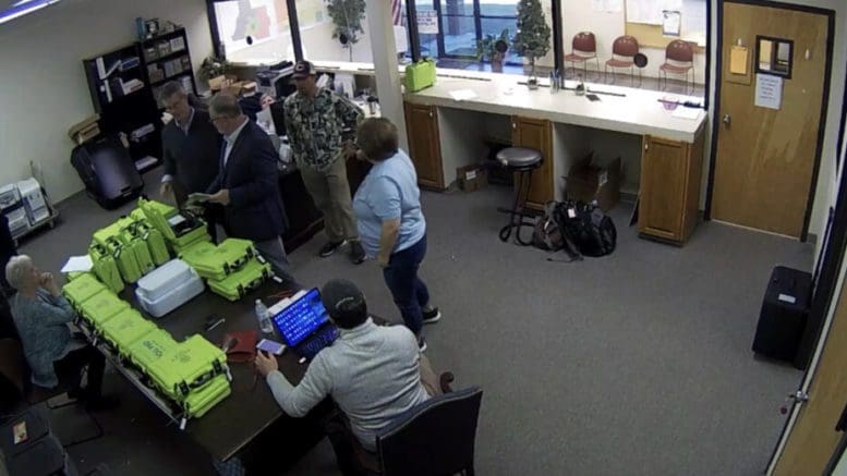 An image from video surveillance recorded Jan. 7, 2021, shows former Coffee County Republican Party Chair Cathy Latham and Election Director Misty Hampton. Screenshot from Coffee County video