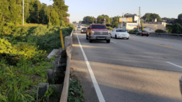 South Cobb Drive from a narrow shoulder facing oncoming traffic