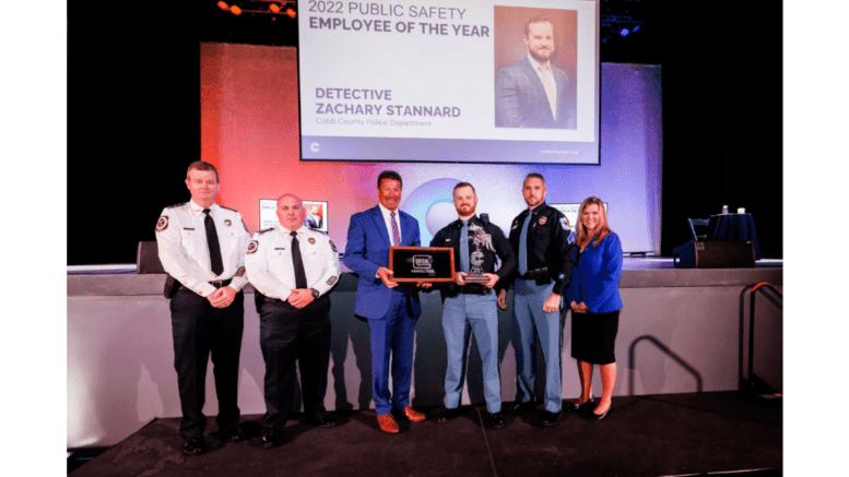 public safety personnel giving certificate to Cobb police detective