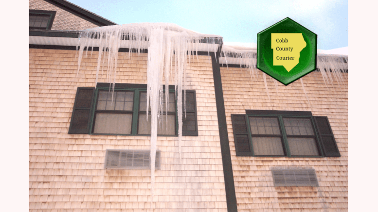 A king-sized icicle hanging from a motel roof.