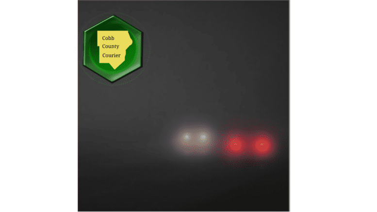 Headlights of two approaching cars through thick fog