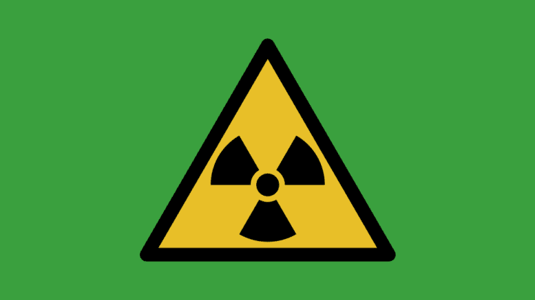 A radioactivity warning triangle with three internal triangles arranged around a dot with their points inward toward the center