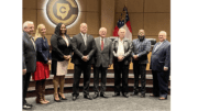 Cobb County Board of Education (l-r) Randy Scamihorn, Becky Sayler, Nichelle Davis, Superintendent Chris Ragsdale, David Chastain, David Banks, Leroy Tre’ Hutchins, Brad Wheeler standing in a row