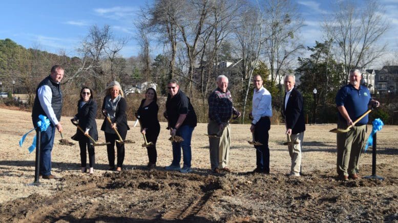 People lined up with shovels. From left, David Carl, President of Gay Construction; Holly Quinlan, CEO of Cobb Travel and Tourism; Councilmember Lynette Burnette; Councilmember Tracey Viars; Mike Everhart, amphitheater committee member; Councilmember Pat Ferris; City Manager Dr. Jeff Drobney; Mayor Derek Easterling; Parks and Recreation Director Steve Roberts